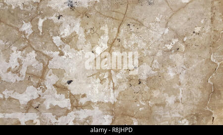 stucco painted white wall textured urban city wall chipped and peeling paint Stock Photo