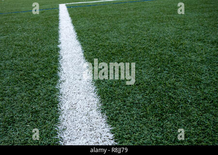 painted white boundary lines of a artficial plastic lawn Stock Photo