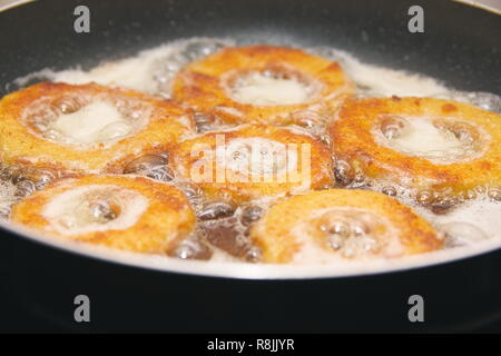 Breaded Zucchini Rings in Frying Pan Closeup Stock Photo