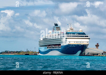 Cruise ship in Caribbean island of Aruba - cruise port with two docked cruise ships in the port of Oranjestad wait for cruise vacation passengers Stock Photo