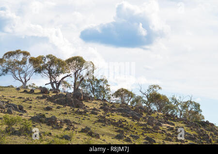 Rocky australian countryside on an overcast day as the sun starts coming out Stock Photo