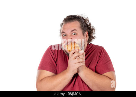 Funny fat man eating croissant Stock Photo