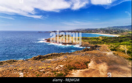 Geological Bombo Quarry of hexagonal basalt rocks on Australian Pacific coast of Kiama town on a sunny summer day. Stock Photo