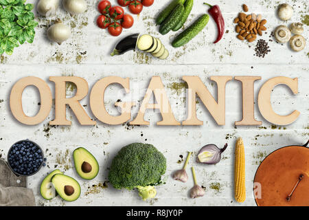 Word 'Organic' in wooden letters with many cooking ingredients on solid background