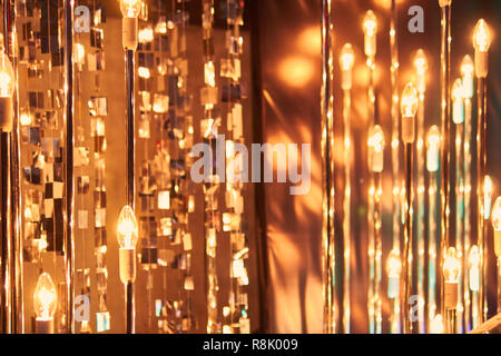 blurred defocused red bright light. lens flare. shiny spots. dark background Stock Photo
