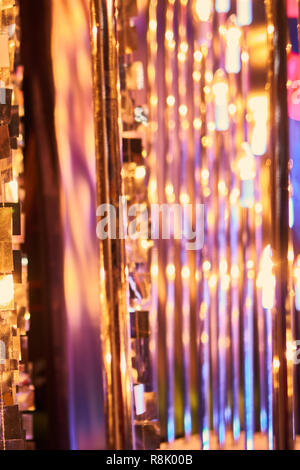 blurred defocused red bright light. lens flare. shiny spots. dark background Stock Photo