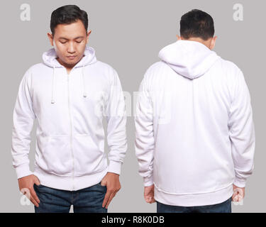 Blank sweatshirt mock up, front, and back view, isolated on grey. Asian male model wear plain white hoodie mockup. Hoody design presentation. Jumper f Stock Photo