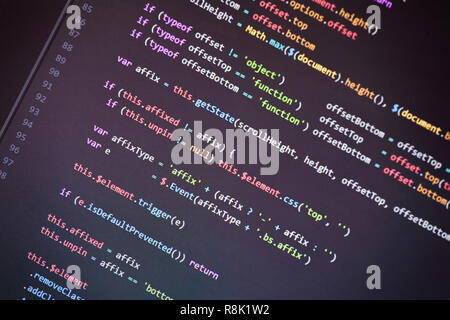 Colorful programming php and html source code on a monitor written by a young programmer. Stock Photo