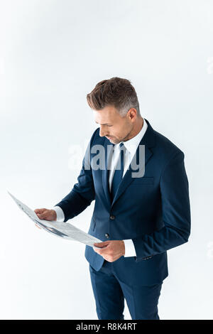 high angle view of handsome businessman reading newspaper isolated on white Stock Photo