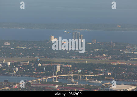 Airplane departure from Cebu Mactan International Airport in an overview seightseeing point Tops Cebu City view to Cebu-Mandaue-Mactan-Olango Stock Photo