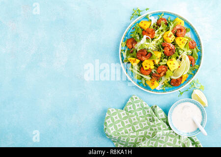 Mango shrimps salad with red pepper and lime juice. Seafood. Top view. Flat lay Stock Photo