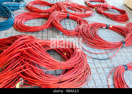 Large rolls of data cables ready to connect television data center during the retransmission of an event. Stock Photo