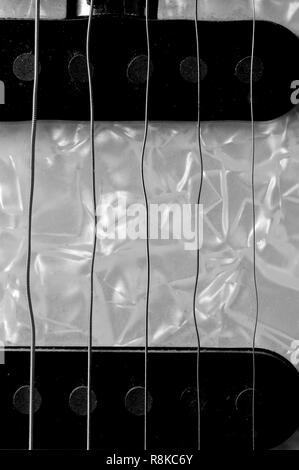 Wavy guitar strings on an electric guitar Stock Photo