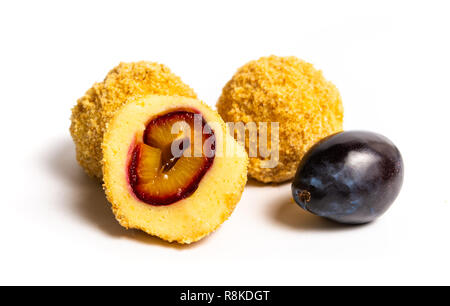Bread crumb dumplings with plums isolated on white Stock Photo