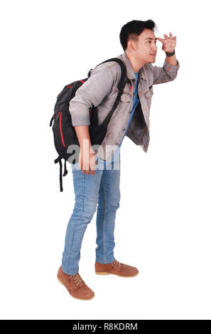 Photo image portrait of a young Asian male student standing and looking forward, side view, isolated on white Stock Photo