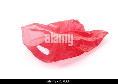 Floating empty red plastic garbage bag isolated on white background, clipping path around the bag, not around the cast shadow, included. Stock Photo