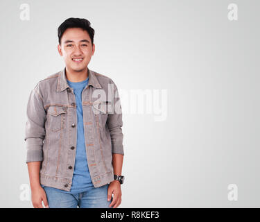 Photo image portrait of a cute young successful Asian male student, in relaxed standing position Stock Photo