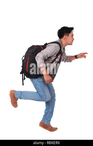Photo image portrait of a young Asian male student running forward, side view, isolated on white Stock Photo