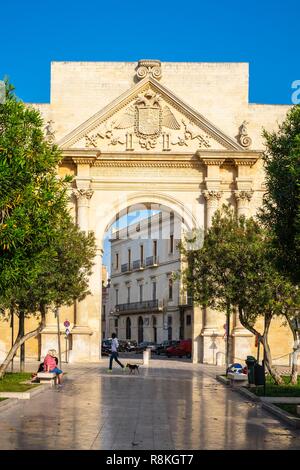 Italy, Apulia, Salento region, Lecce, Porta Napoli, imitating a triumphal arch, is one of the gateways to the historic centre, built in 1548 in honor of Emperor Charles V Stock Photo