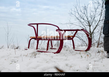 red sledge in the snow Stock Photo