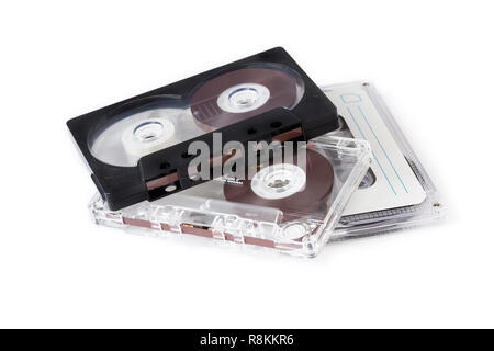 Three compact cassettes on white background.Retro. Stock Photo