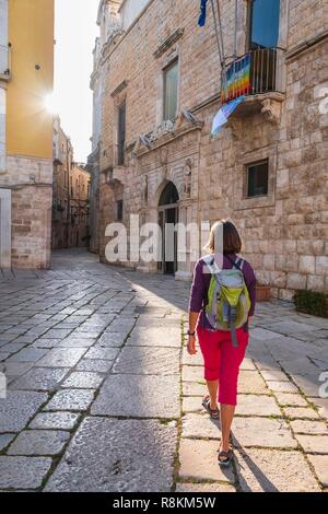 Italy, Apulia, Molfetta, alley in the historical centre, on the right sid the Palazzo Giovene (16th century) that houses the town hall Stock Photo