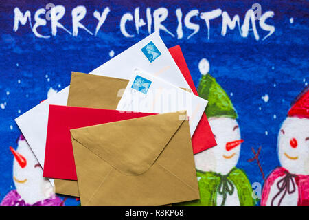 Envelopes, mail post, Christmas cards, on Christmas door mat Stock Photo