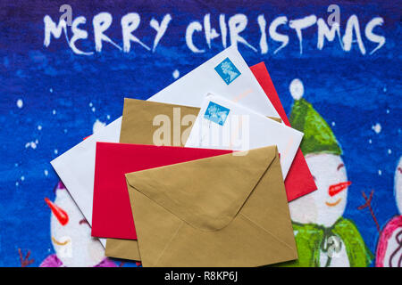 Envelopes, mail post, Christmas cards, on Christmas door mat Stock Photo