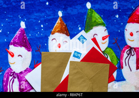 Envelopes, mail post, Christmas cards, on Christmas door mat Stock Photo