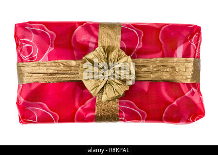 Gift box wrapped in red rose cellophane, decorated with golden raffia ribbon  and bow isolated on the white background Stock Photo - Alamy