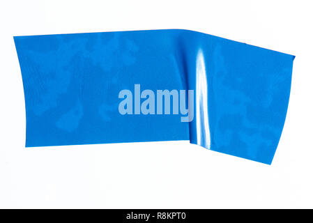 Piece of blue masking tape close up isolated on white background Stock Photo