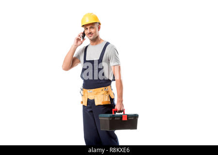 construction worker in helmet talking on smartphone isolated on white Stock Photo