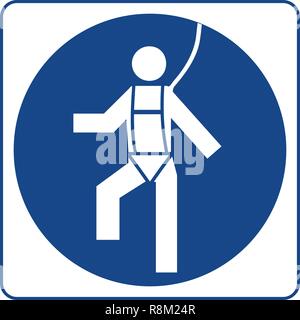 Industrial worker with safety harness mandatory use warning sign ...