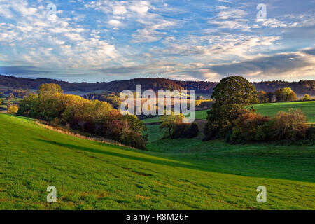 An autumn fall view of the rolling hills of the Cotswolds in Gloucestershire, England.