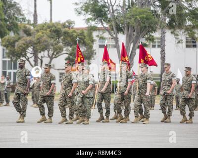 U.S. Marines with 3rd Assault Amphibian Battalion, 1st Marine Division march during a relief and appointment, and retirement ceremony for Sgt. Maj. Christopher Slattery on Camp Pendleton, Calif., May 5, 2017. Sgt. Maj. Slattery relinquished his post as Sgt. Maj. of 3rd Assault Amphibian Battalion, 1st Marine Division before retiring after serving honorably for 30 years. Stock Photo