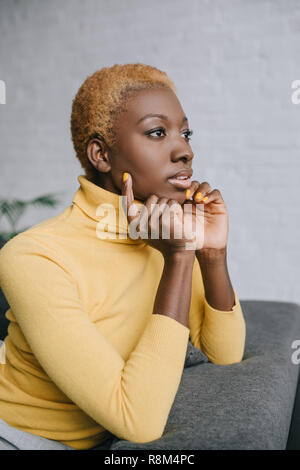 selective focus of dreamy african american woman with short hair Stock Photo