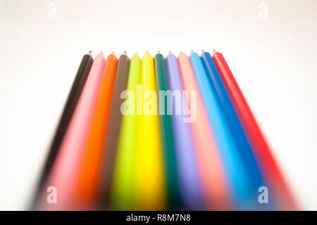 Macro of color pencils, all lined up, isolated on white background Stock Photo