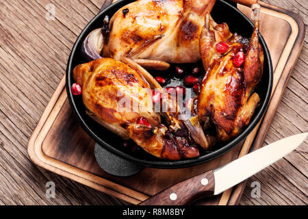 Carcasses of quail roasted with pomegranate sauce Stock Photo