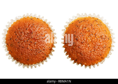 Two homemade cupcakes with poppy seeds isolated on white. Top view. Stock Photo