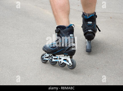 Voronezh, Russia - June 24, 2018: Roller skates on human legs close up Stock Photo
