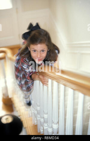 Girl sliding down banister on steps - Stock Image - F006/4393 - Science  Photo Library