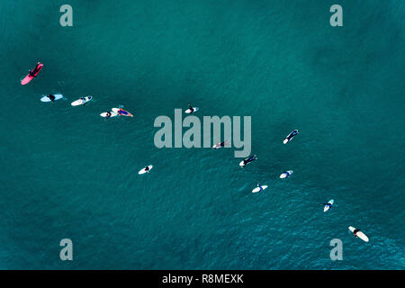 Aerial view of surfers in the ocean at the Baleal beach in Peniche, Portugal Stock Photo