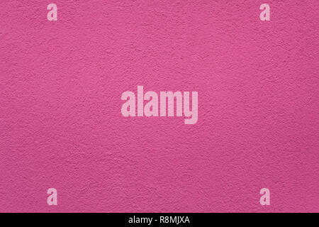 Pink painted stucco wall on Burano Island in the Venetian Lagoon near Venice, Italy. Background texture. Stock Photo