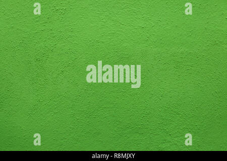 Green painted stucco wall on Burano Island in the Venetian Lagoon near Venice, Italy. Background texture. Stock Photo
