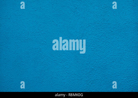 Blue painted stucco wall on Burano Island in the Venetian Lagoon near Venice, Italy. Background texture. Stock Photo