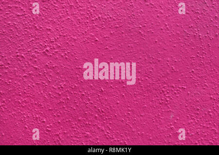 Bright pink painted stucco wall on Burano Island in the Venetian Lagoon near Venice, Italy. Background texture. Stock Photo