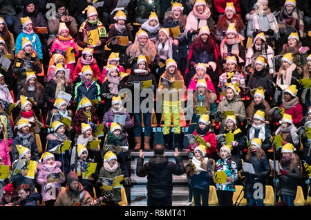 Dortmund, Germany. 16th Dec, 2018. The WDR children's choir of the Dortmund Choir Academy sings the largest Christmas song in Germany at Signal Iduna Park, according to the organisers. 50,000 singers were expected in the BVB stadium. Credit: Bernd Thissen/dpa/Alamy Live News