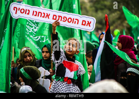 Gaza, Palestine. 16th Dec 2018. Thousands of Palestinians gather for a rally in the centre of Gaza City to celebrate Hamas 31th anniversary on 16th December 2018. Credit: ZUMA Press, Inc./Alamy Live News Credit: ZUMA Press, Inc./Alamy Live News Stock Photo