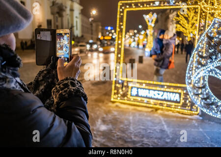 Warsaw, Poland. 16th December, 2018.  Christmas season lights are a major attraction for tourists and residents every year. Several kilometers of city streets including Royal Route are decorated with thousands of lamps. Robert Pastryk / Alamy Live News Stock Photo