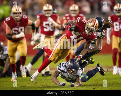 Seattle Seahawks free safety Tedric Thompson (33) reaches out to intercept  a pass intended for Los Angeles Rams tight end Gerald Everett, center,  during the second half of an NFL football game